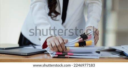 Business accountant working with documents paper in hands at table office, Selective focus.