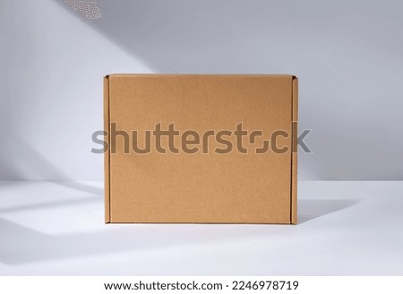Empty cardboard Box with window shadow Royalty-Free Stock Photo #2246978719