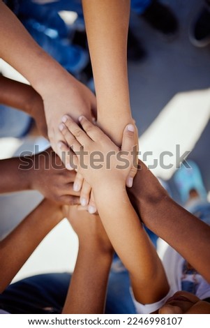 Hands, together and support, children solidarity and trust, commitment and team motivation top view. Diversity, teamwork and youth group with development, growth and kids community with connection Royalty-Free Stock Photo #2246998107