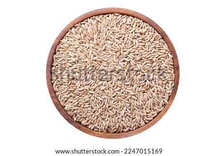 Bowl of rye grains isolated on white background, top view Royalty-Free Stock Photo #2247015169