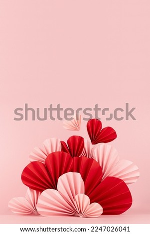 Sweet happiness Valentine day scene mockup - soar pink, red origami paper hearts on pink color, vertical, copy space. Romantic template for advertising, display, presentation cosmetic product, card. Royalty-Free Stock Photo #2247026041