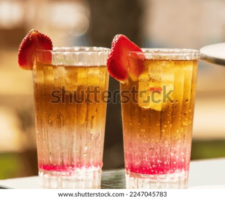cold fruit cocktail on sunburst background