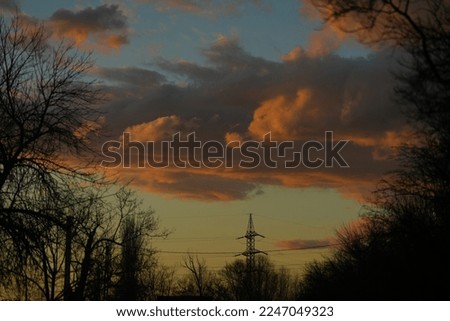 Sky with clouds at sunset. Sunset sky clouds. Cloudy sky at sunset. Beautiful sunset sky clouds