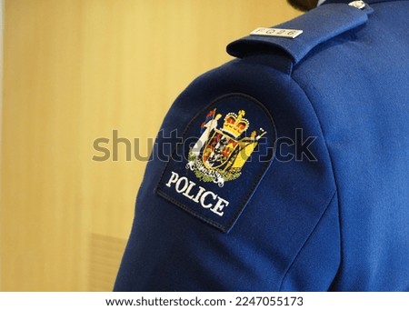 Close up of a New Zealand police arm badge Royalty-Free Stock Photo #2247055173