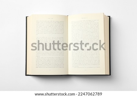 Open book on white background, top view Royalty-Free Stock Photo #2247062789