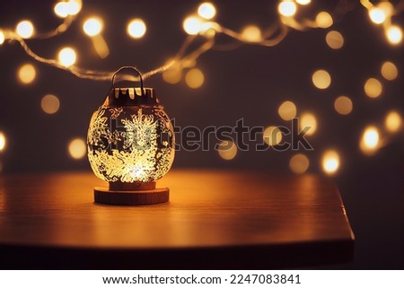Modern lantern on wooden table and unfocused lights at background. Evening magic atmosphere concept picture with dark phantom background view with lamps unfocused illumination
