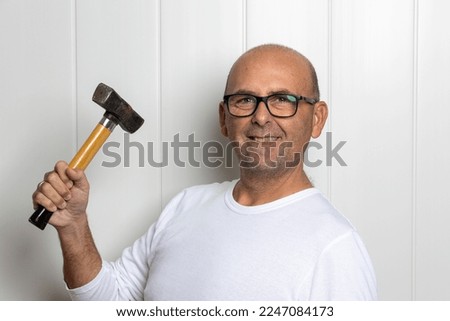 photographs of a man over 50 with construction tools