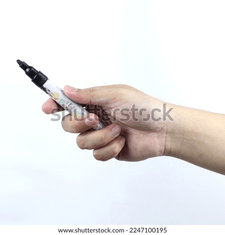 hand holding marker isolated on a white background