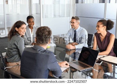 Group of business people have a discussion in meeting room. Formal business team brainstorming over new project. Mature businessman and businesswoman talking and working with business partners. Royalty-Free Stock Photo #2247102507