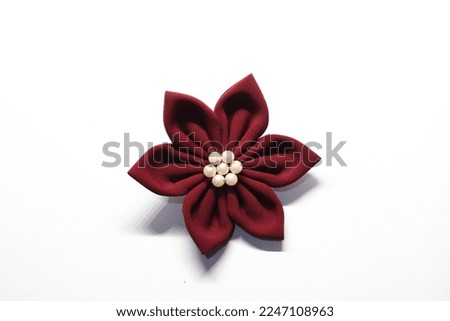 a breastpin flower model isolated on white background Royalty-Free Stock Photo #2247108963