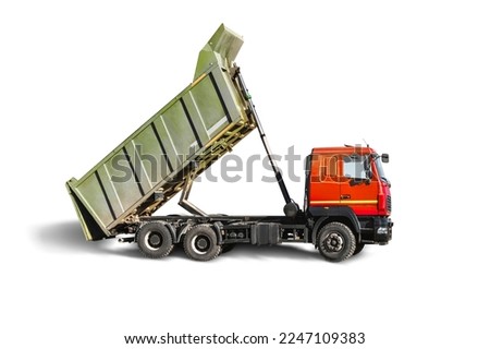 Large dump truck car with a raised body on a white isolated white background. Car for transportation of heavy bulk cargo. Construction equipment. Element for design Royalty-Free Stock Photo #2247109383