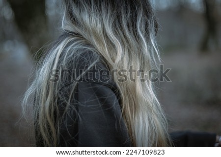 A photo of a girl's blonde hair