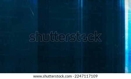 Distressed overlay. Dust scratch texture. Light flare noise. Blue white glow smeared wet stains on dark weathered abstract empty space background. Royalty-Free Stock Photo #2247117109