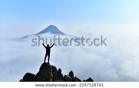 Mountain Reaching to the Sky in the Mist Royalty-Free Stock Photo #2247128761
