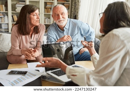 Tax advisors or senior advisors give seniors advice on pension and pension insurance Royalty-Free Stock Photo #2247130247