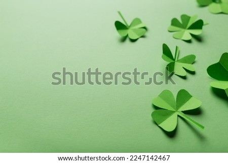 St. patrick's day. green background with clover leaves: shamrocks . copy space. Paper craft.