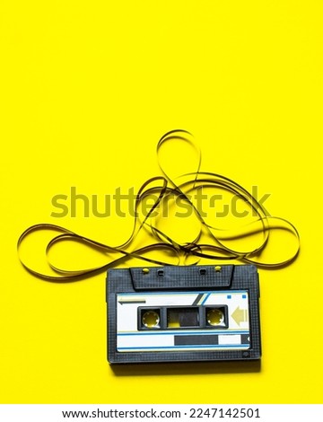 Tape Cassette on colour Background  Royalty-Free Stock Photo #2247142501