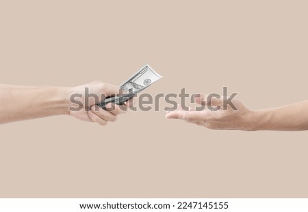 Hand giving and receiving money
