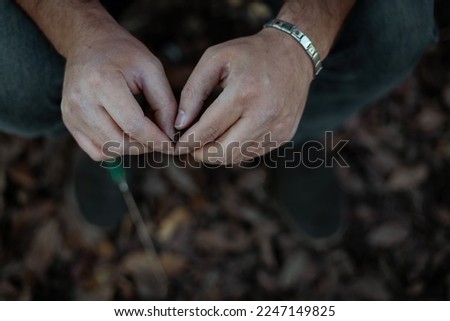 A picture of the man's dirty hands.