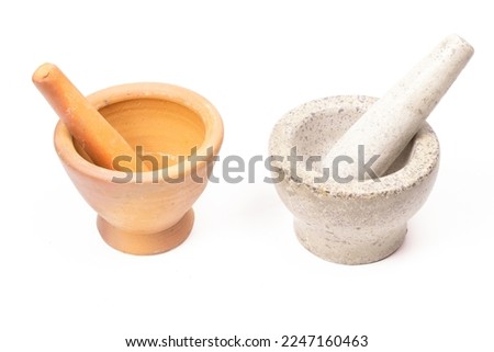 Set stone mortars and terracotta mortars with pestles are small isolated on white background.