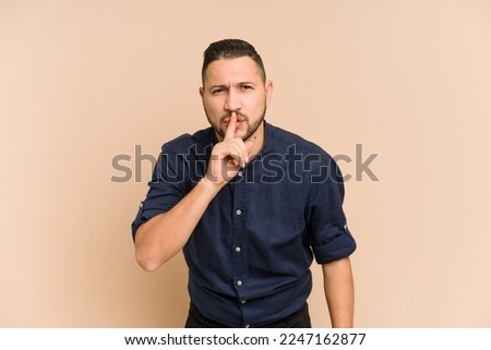 Adult latin man cut out isolated keeping a secret or asking for silence.
