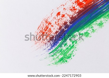 Acrylic red blue gree paint on white paper. Rainbow brush strokes collection