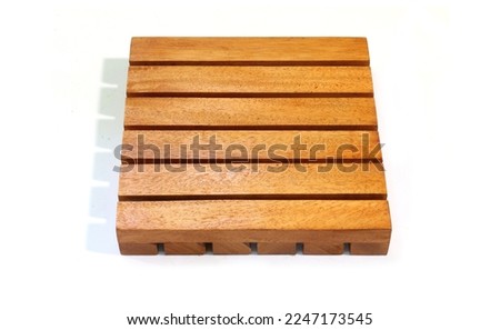 Square shaped wooden mat for food photography.