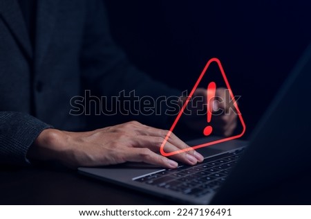 Businessman working on the computer. Warning alert system concept, hacked on the computer network, crime and virus, Malicious software, compromised information, illegal connection, data vulnerability Royalty-Free Stock Photo #2247196491