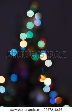 Blurred background, abstraction of a night holiday, party, multi colored lights, beauty city life