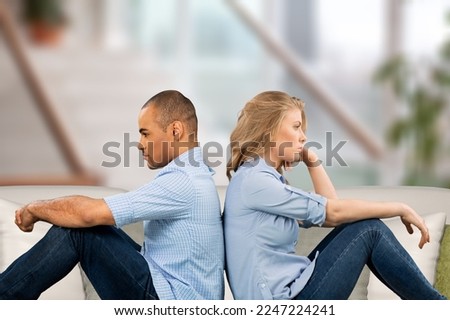 Unsuccessful sad married couple at home Royalty-Free Stock Photo #2247224241