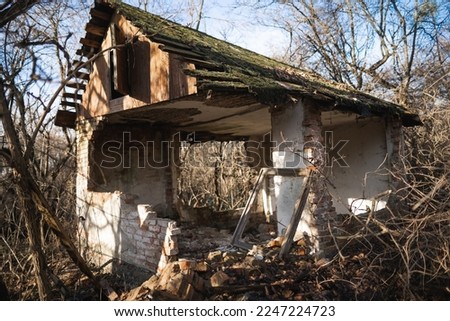 old ruined house, not suitable for living, fallen brick wall Royalty-Free Stock Photo #2247224723