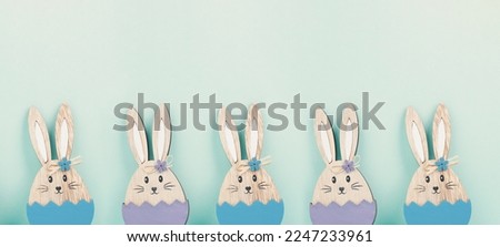 Panoramic easter holiday greeting card with cute bunnies, rabbits in spring, banner or header