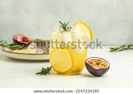 passionfruit cocktail. Tropical drink for summer party. on a light background, refreshing drink or beverage with ice, place for text. Royalty-Free Stock Photo #2247234185