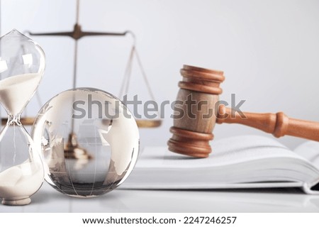 International Law concept. World globe and scales Royalty-Free Stock Photo #2247246257