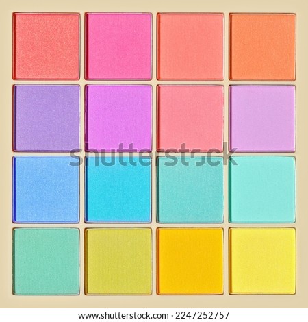 Vivid colored eye shadow makeup palette, pink, violet, blue, green colors. Female cosmetic and beauty product, shiny eye shadow in square package, aesthetic texture background, barbie style, top view Royalty-Free Stock Photo #2247252757
