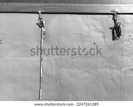 A black and white image of ropes hanging in NYC.