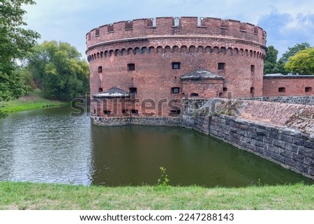 ancient round watchtower and fortress walls of the fortress in the Russian city of Kaliningrad