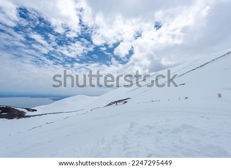 Winter arctic landscape. Snow-covered tundra. Snowy ground surface. Cold frosty winter weather. The harsh climate of the polar region. Endless arctic desert. Royalty-Free Stock Photo #2247295449