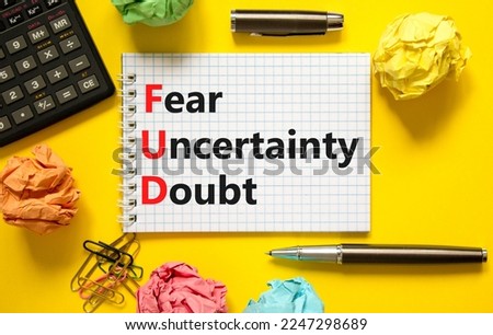 FUD fear uncertainty doubt symbol. Concept words FUD fear uncertainty doubt on white note on a beautiful yellow background. Calculator. Business FUD fear uncertainty doubt concept. Copy space. Royalty-Free Stock Photo #2247298689