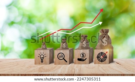Wooden blocks with money bag with Coins for investment loan planned future concept. saving, charity, family finance plan concept, fundraising, superannuation, financial crisis concept