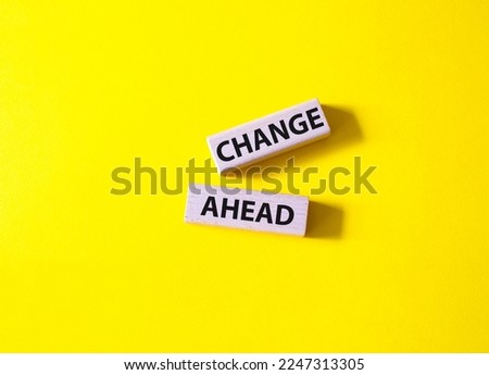 Change ahead symbol. Wooden blocks with words Change ahead. Beautiful yellow background. Business andChange ahead concept. Copy space.