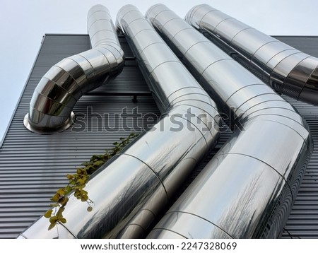 Aluminum pipes on the exterior of a building