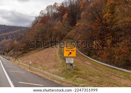 runaway truck ramp on highway road  Royalty-Free Stock Photo #2247351999