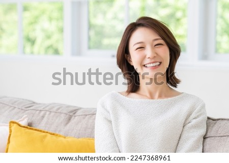 young attractive asian woman relaxing Royalty-Free Stock Photo #2247368961