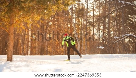 Banner Cross country skiing, winter sport on snowy track, sunset sun light background.