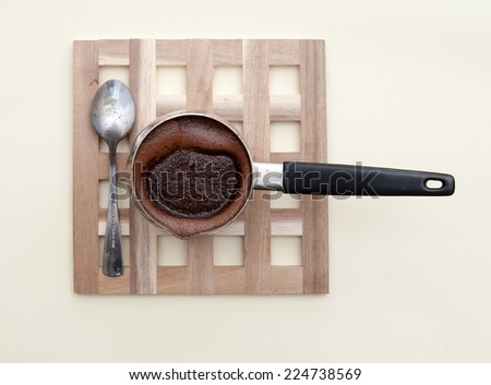 Turk with boiled coffee on stand Royalty-Free Stock Photo #224738569