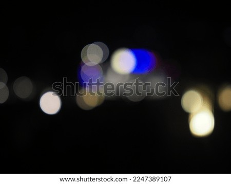Bokeh light in the city night background. Abstract bright blurred colored bokeh. 
