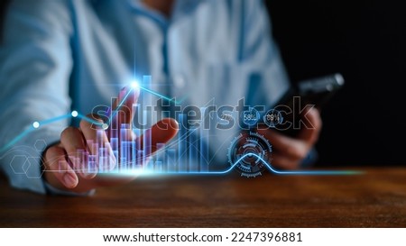 Economic analysis concept. Businessman analyze graph growth of business amid the global economic crisis, Strategy and planning, Recovery of business, Analyzing and data exchange on global networking. Royalty-Free Stock Photo #2247396881
