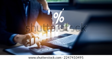 Interest rate and dividend concept, Businessman is calculating income and return on investment in percentage. income, return, retirement, compensation fund, investment, dividend tax, stock market Royalty-Free Stock Photo #2247410495