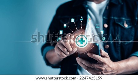 Businessman hand touch on virtual medical health care icons on mobile application. Health service, Life insurance business Concept